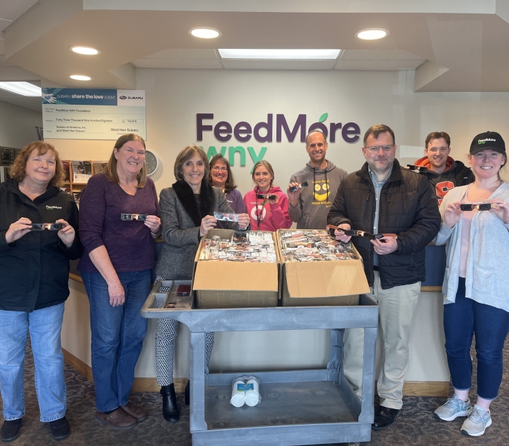 group of people with eclipse glasses