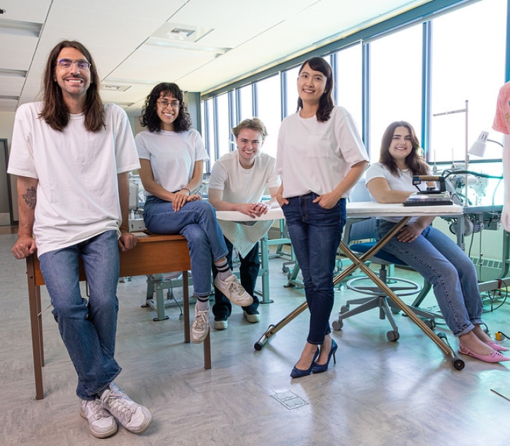 Fashion tech student award winners and their instructor in a group photo