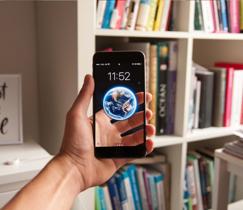 Hand holding up a smart phone