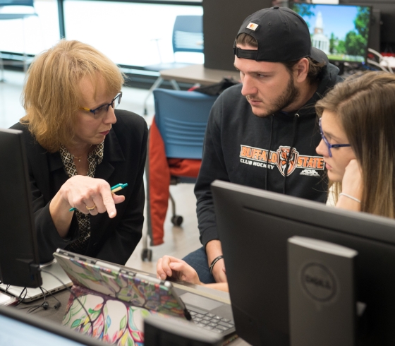 professor speaking with two students