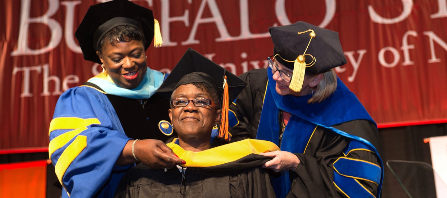 Graduate Commencement student on stage