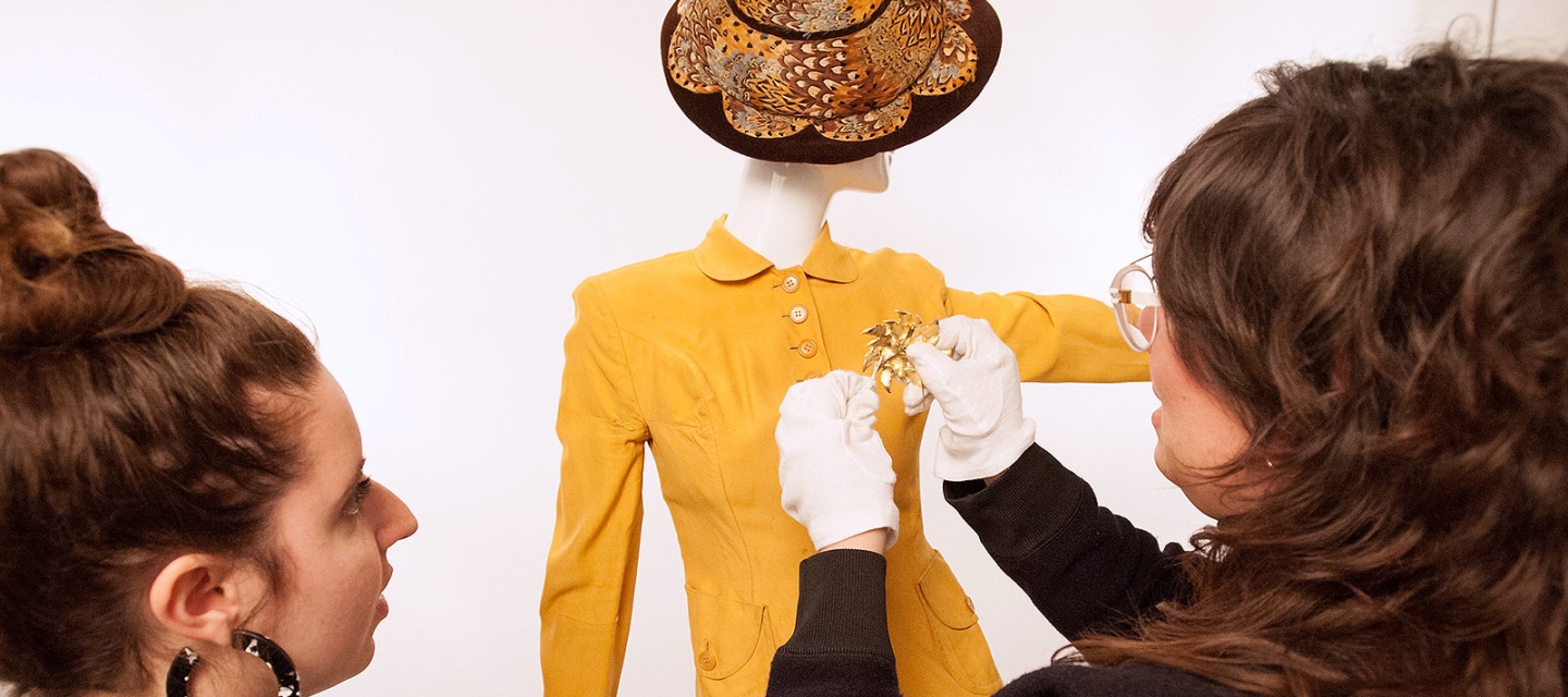 Professor and student styling a fashion piece