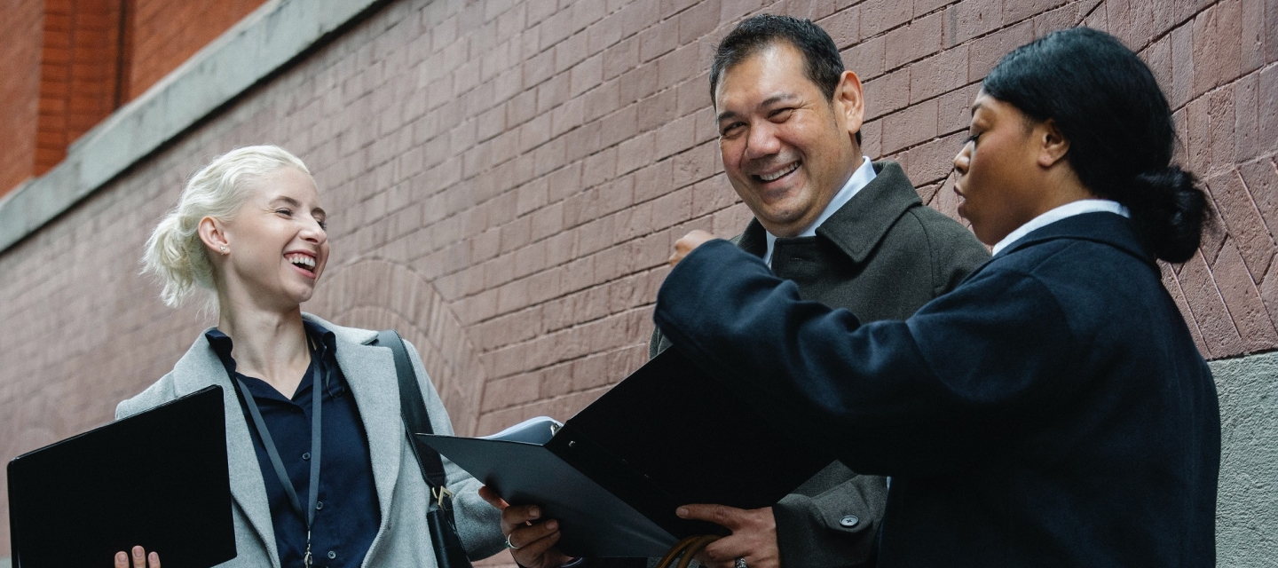 Coworkers chatting on street