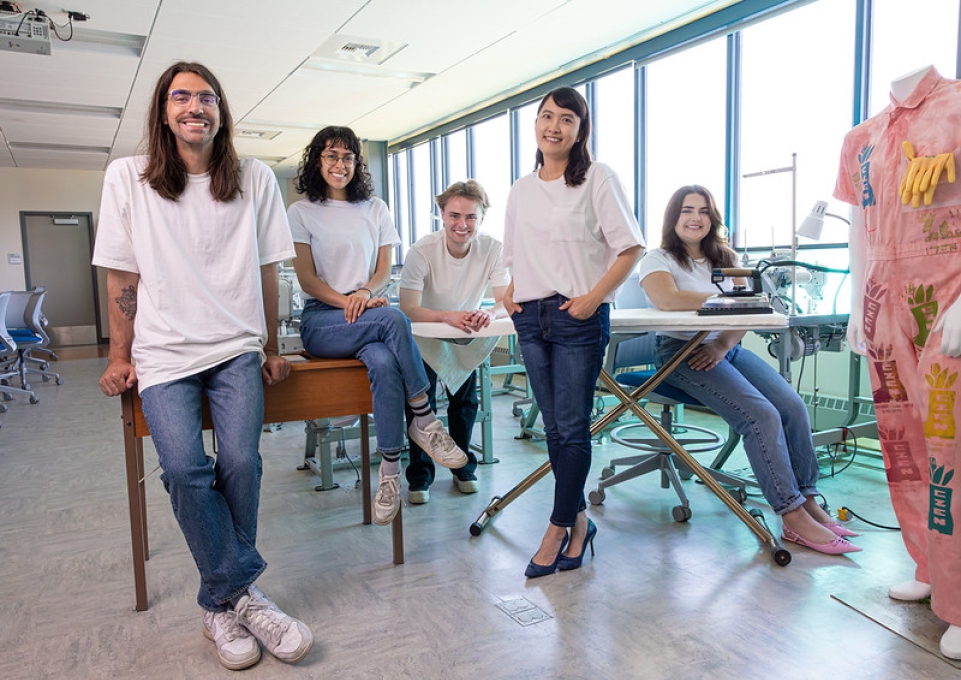 Fashion tech student award winners and their instructor in a group photo